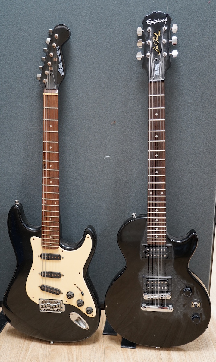 An Epiphone Les Paul Special II UE electric guitar in a soft case and a Marlin SC/100G electric guitar. Condition - fair